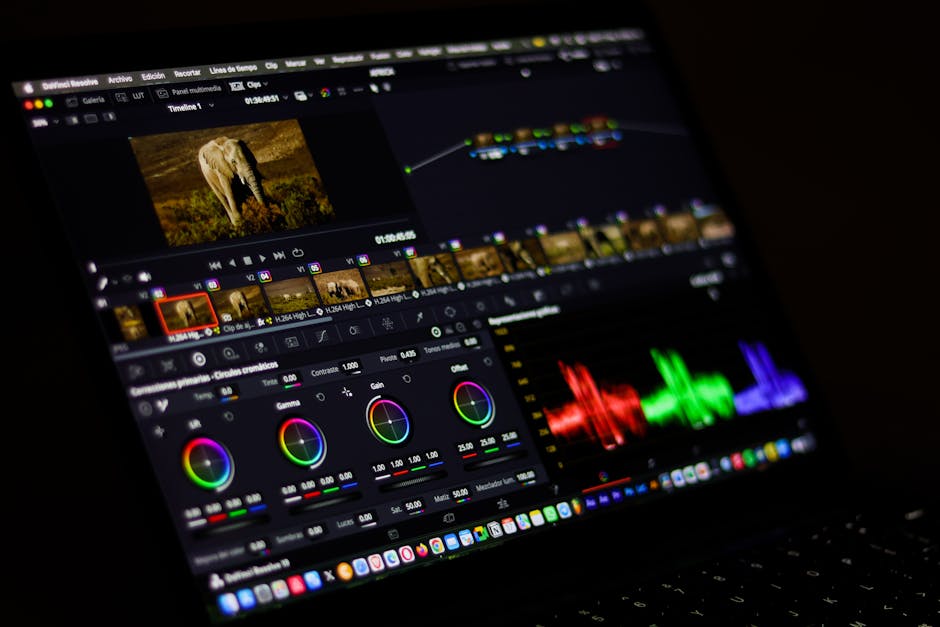 A videographer editing an event videography project on a laptop