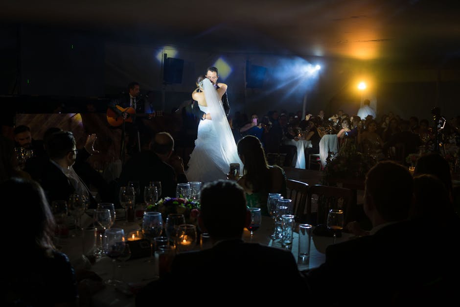 Bride and groom sharing their first dance captured on a wedding film